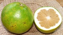 Whole and Cut Pomelos