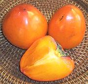 Persimmons, whole and cut