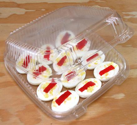 Clamshell filled with stuffed eggs