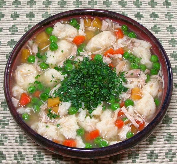 Bowl of Chicken Soup with Dumplings