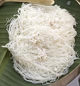 Three Idiyappam Cakes on Banana Leaf