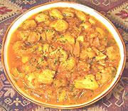 Dish of Chicken in Tomato-Onion Sauce