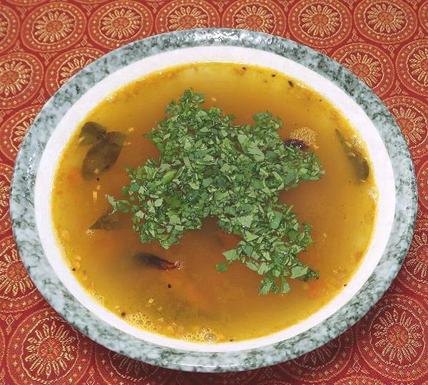 Bowl of Rasam with Lemon