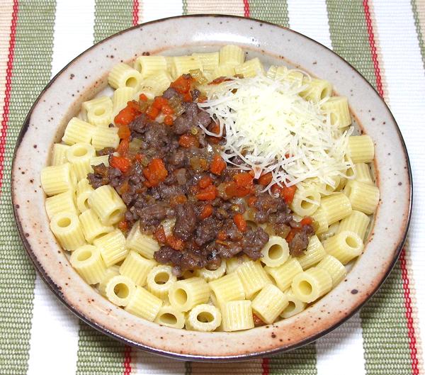 Dish of Pasta with Sausage & Carrot Sauce